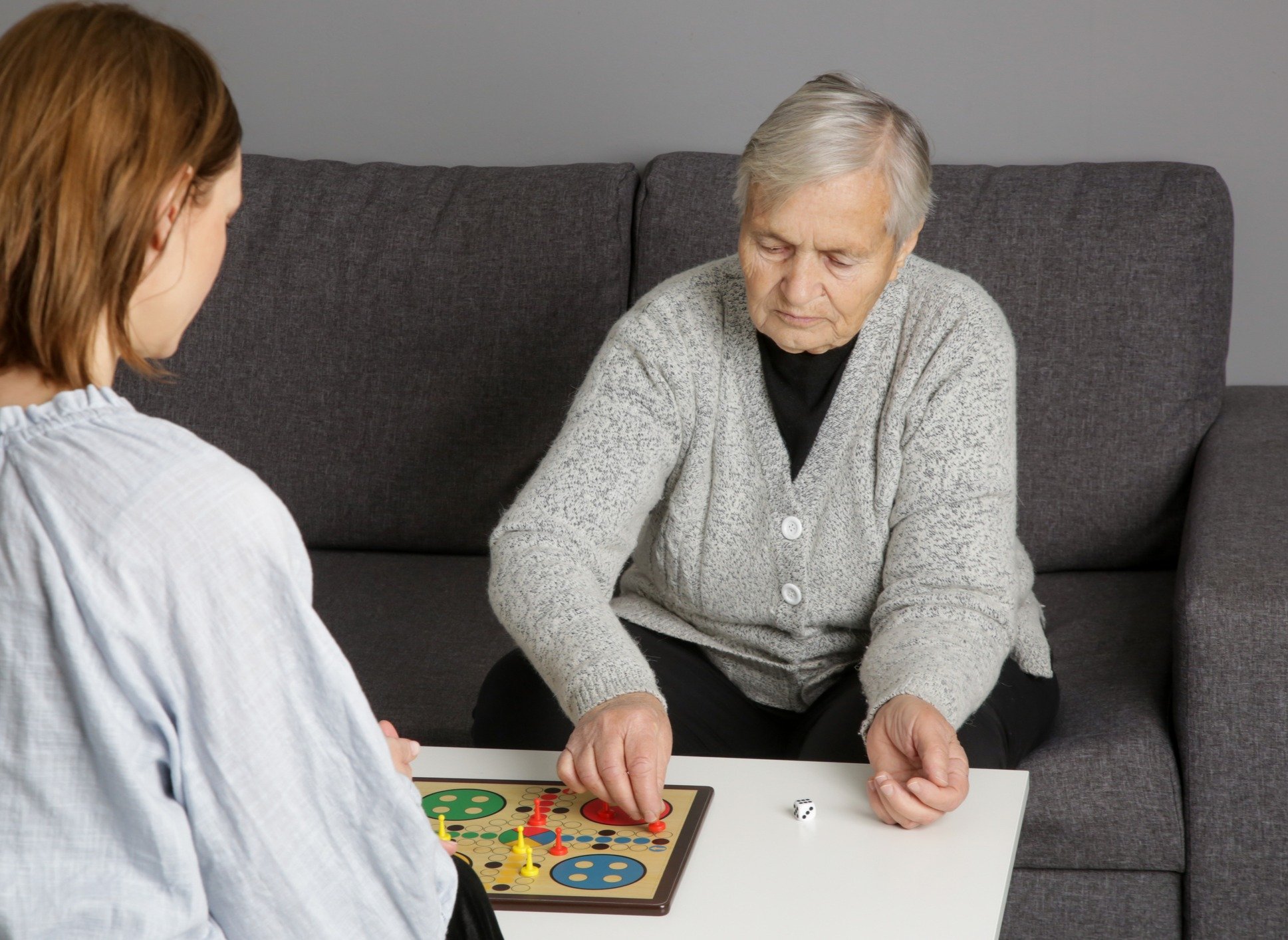 Seniors playing board game