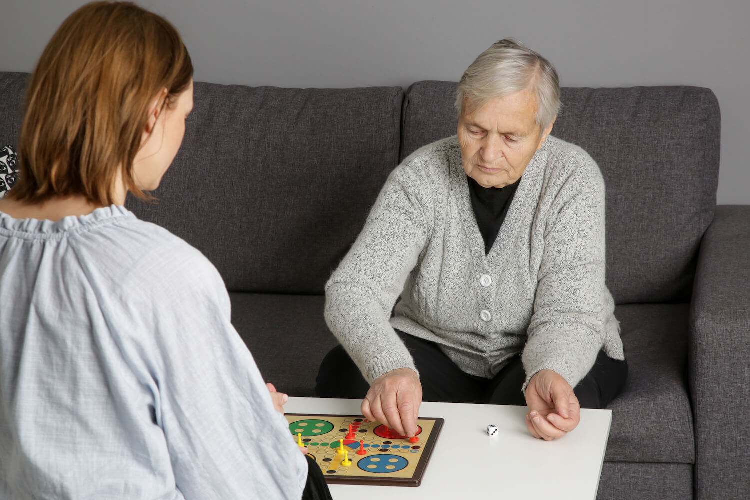 Senior woman playing a board game