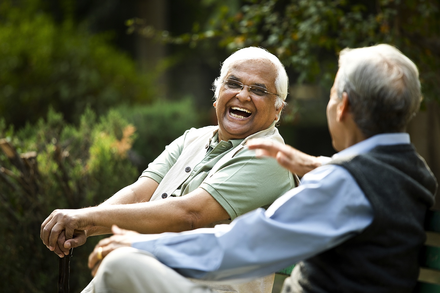 Seniors laughing outdoors