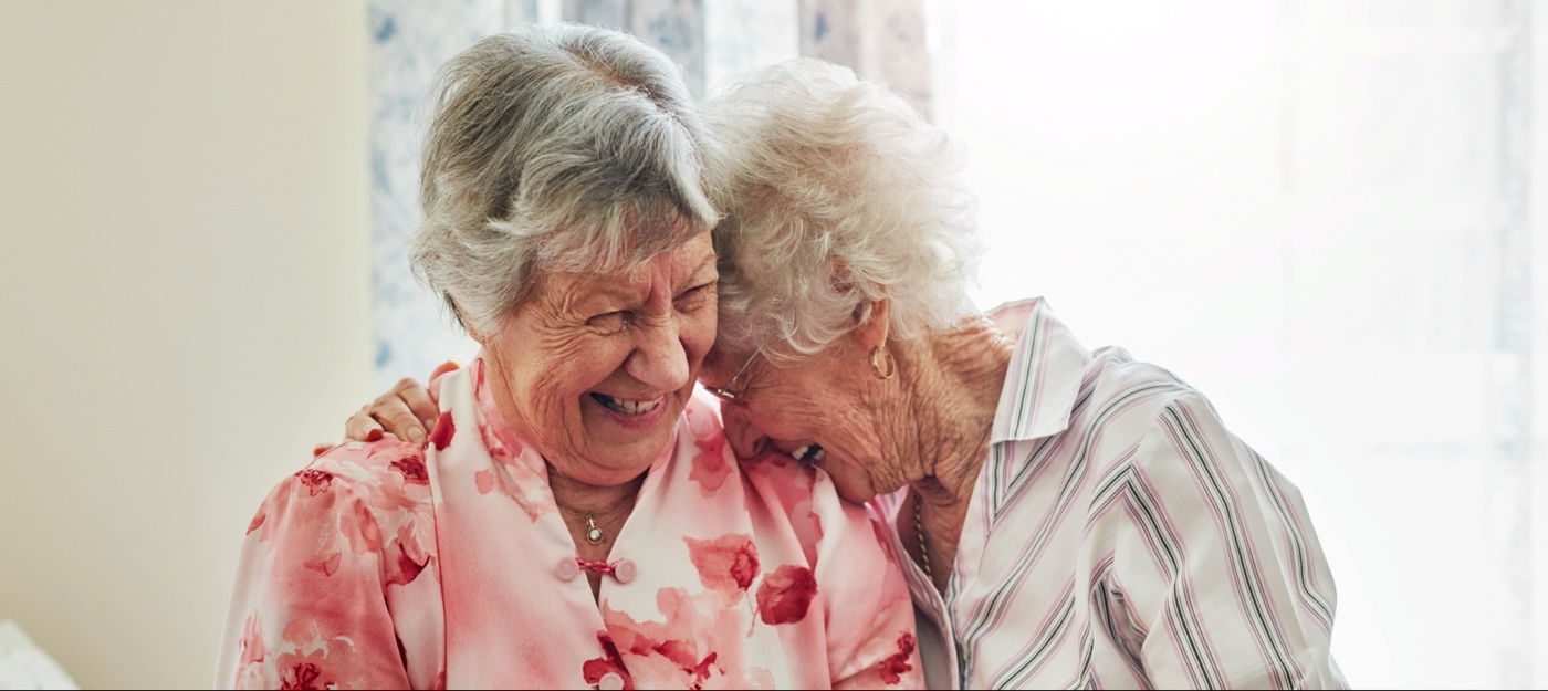 Two seniors laughing together