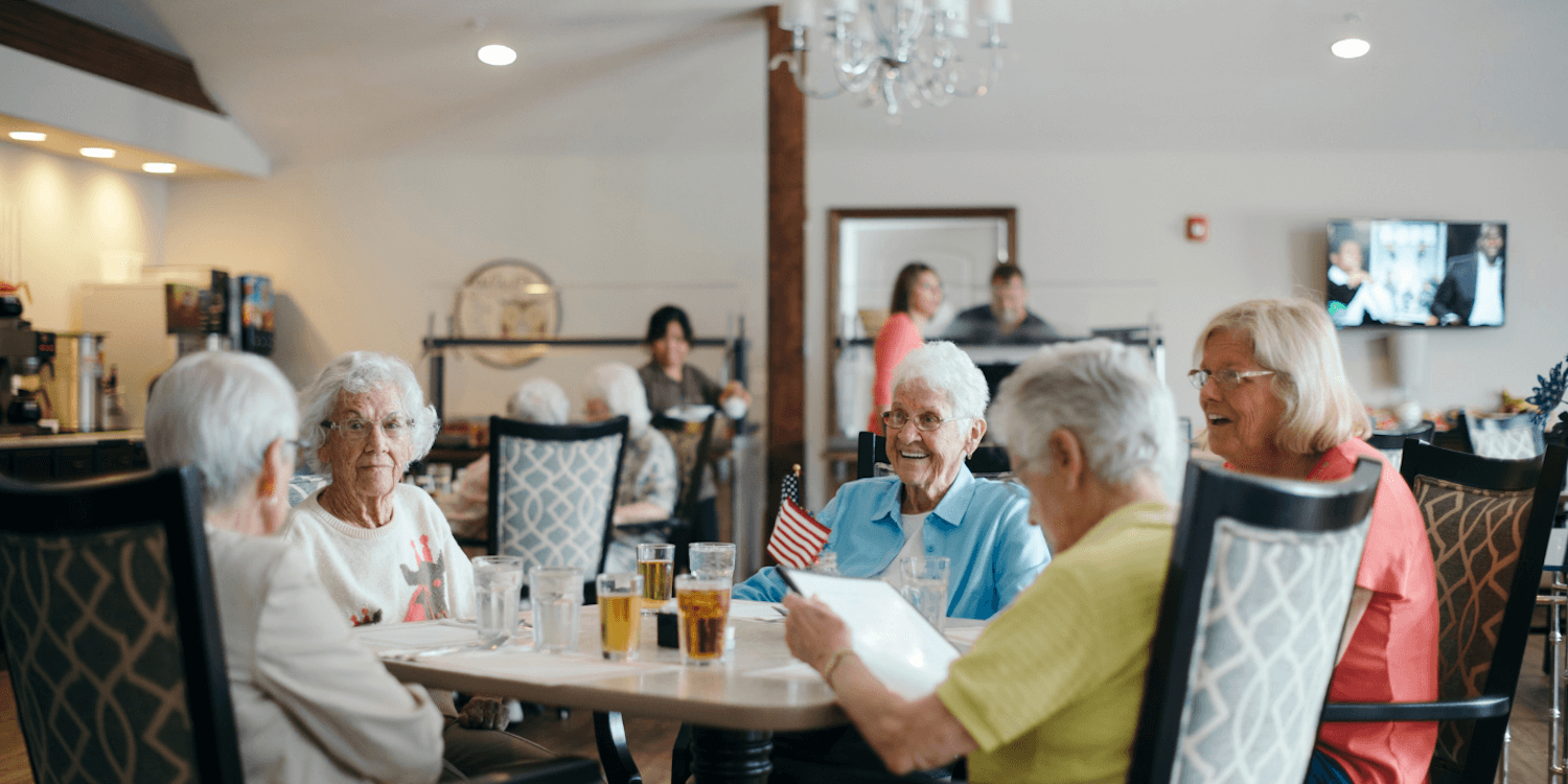 Residents of a Cedarhurst Senior Living Community enjoying a meal together. 