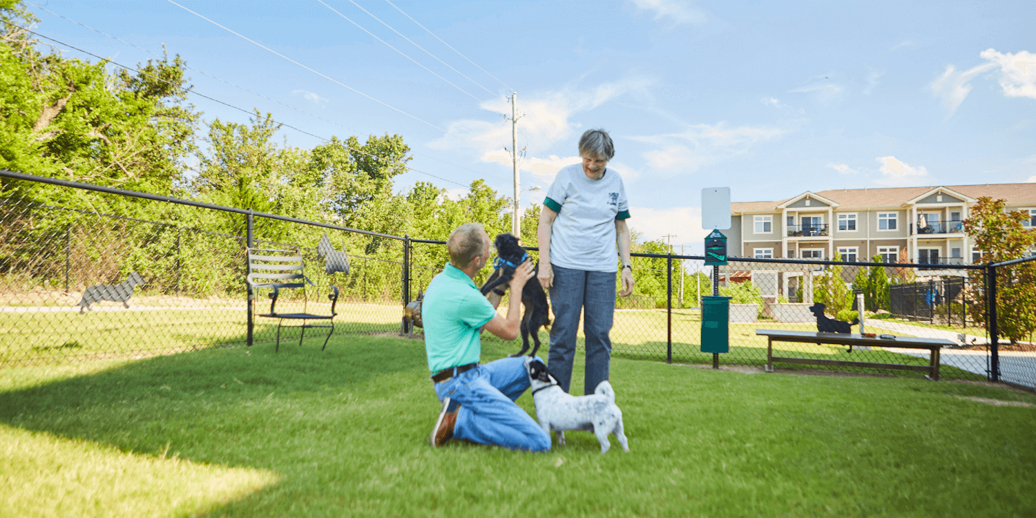 seniors with dogs in the pet designated area