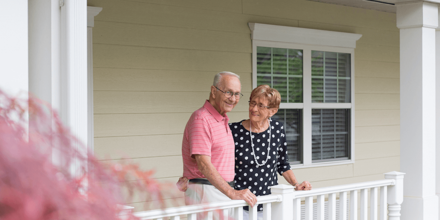 A Cedarhurst resident couple smiles outside together
