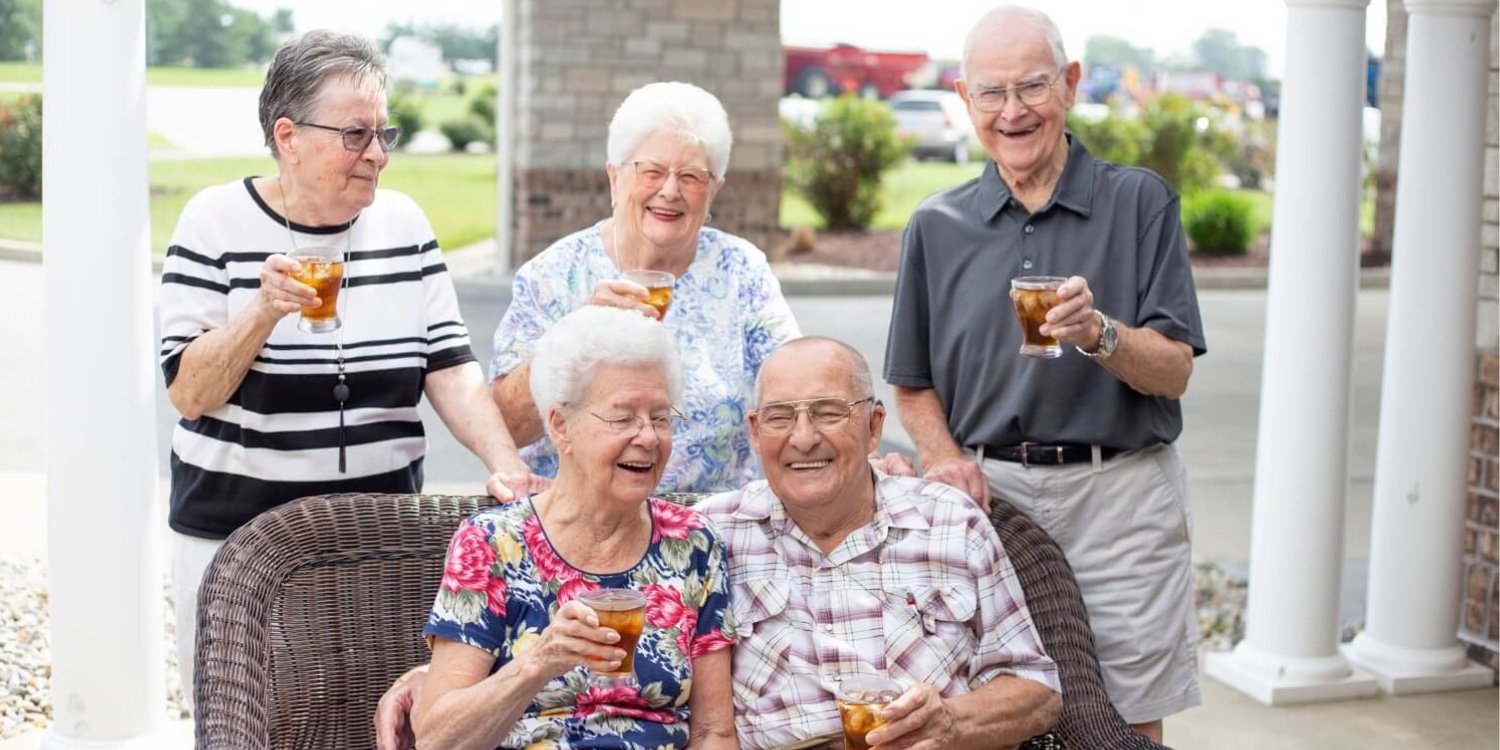 seniors enjoying refreshing iced tea outside