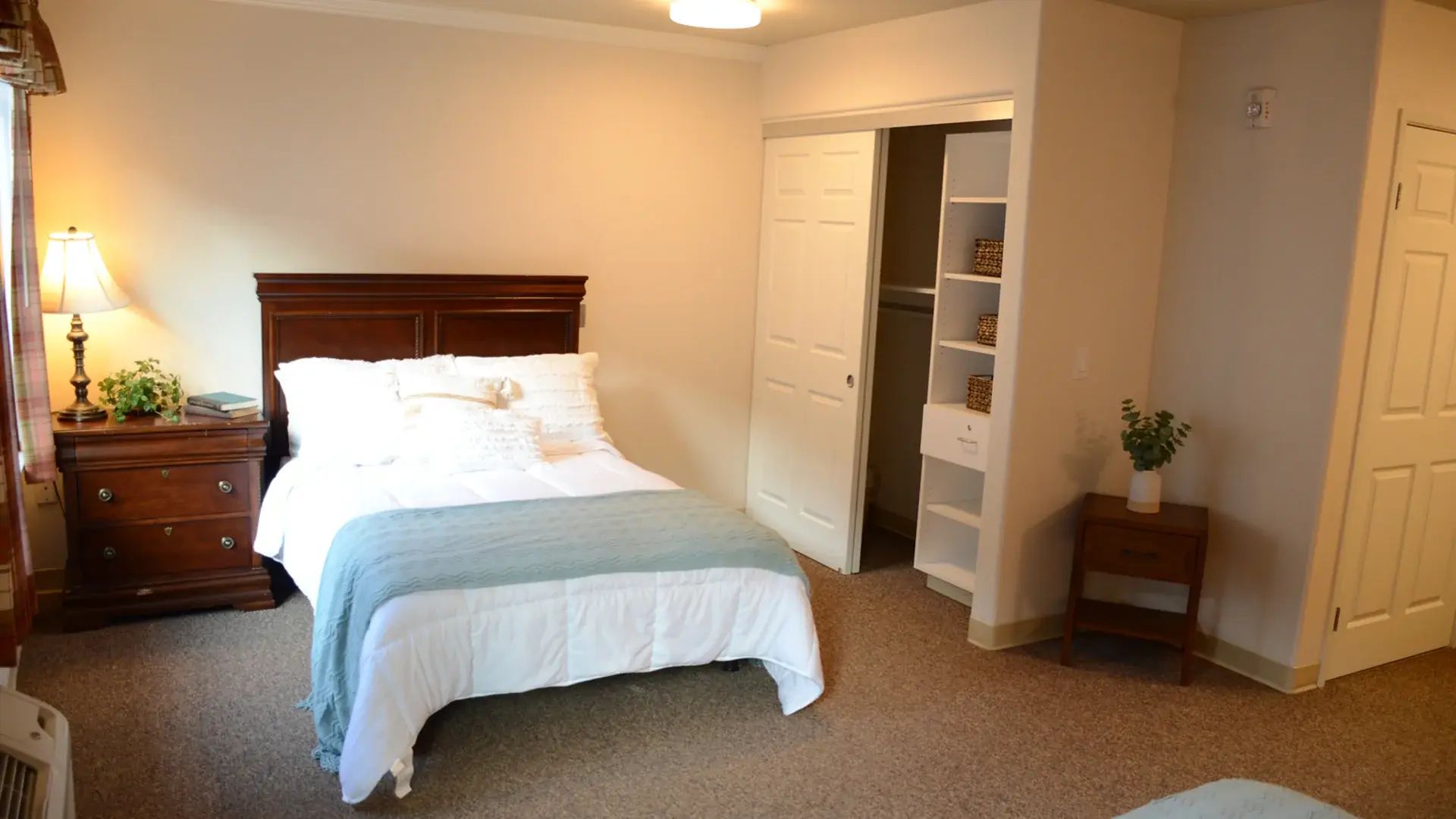 Bedroom of a senior apartment at Cedar Creek of High Plains, designed for comfort and personalization