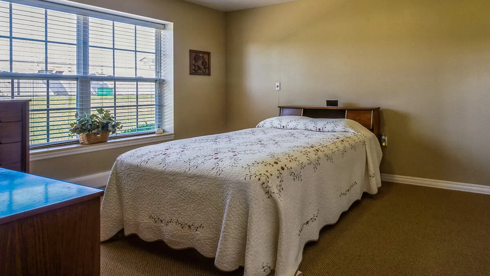 Bedroom of a senior apartment at Cedar Creek of Logansport, designed for comfort and personalization