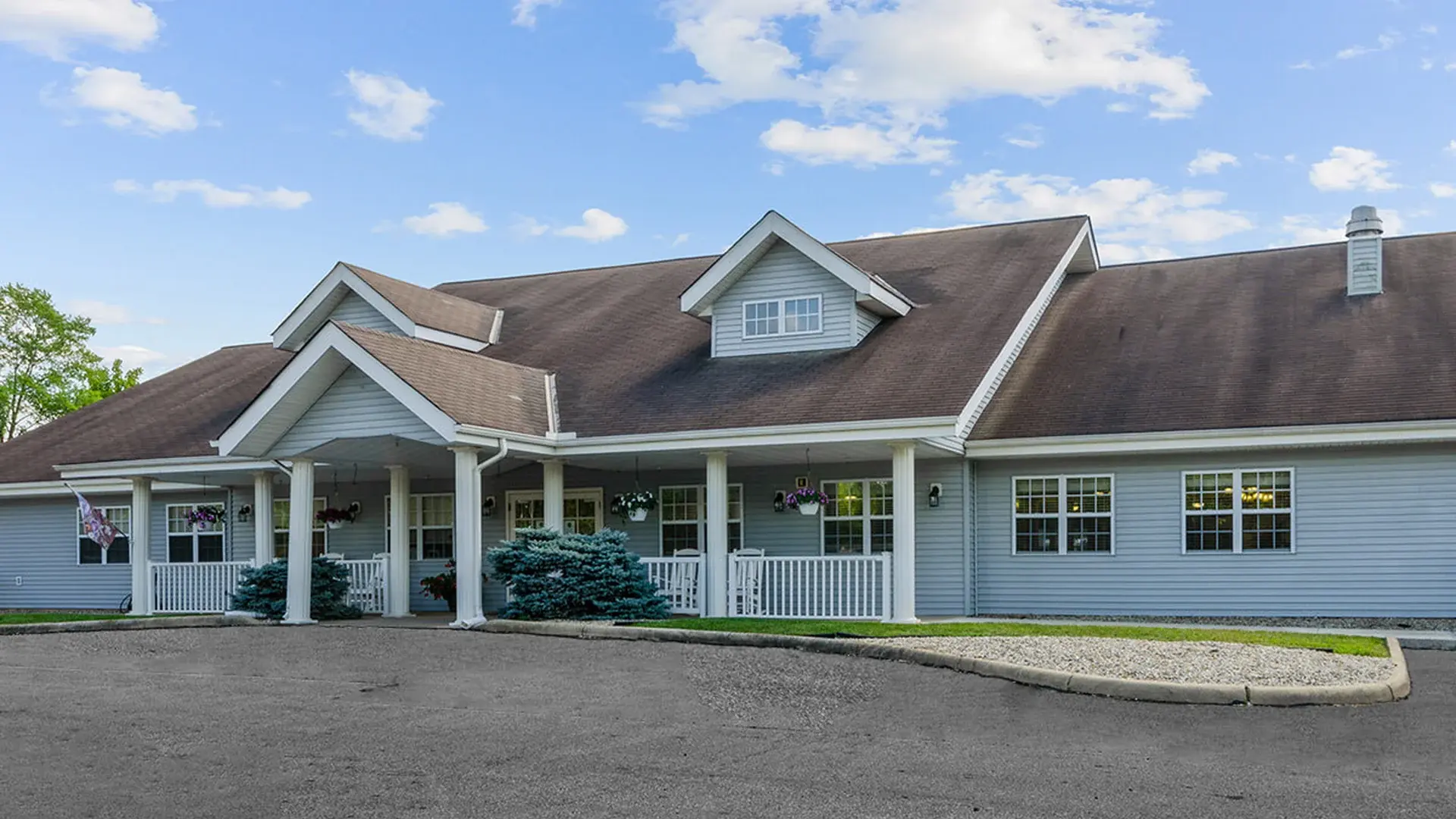 The welcoming front exterior of Cedar Creek of Logansport senior living community
