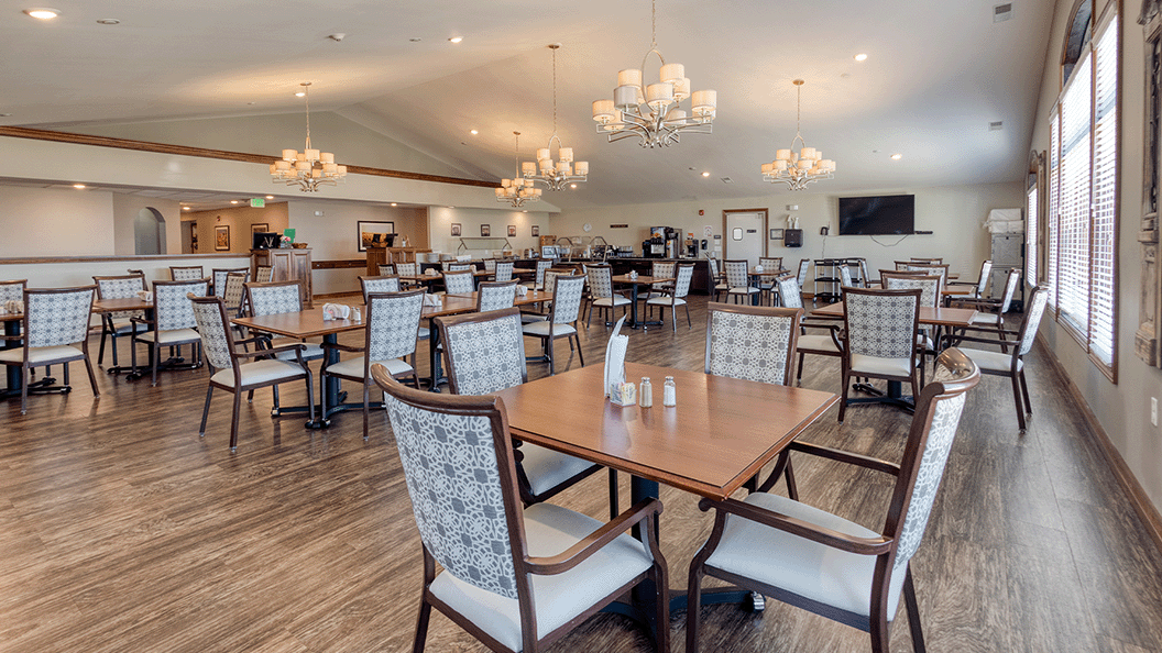 A spacious and bright dining room at Cedarhurst of Bethalto, offering comfortable seating for all-day dining