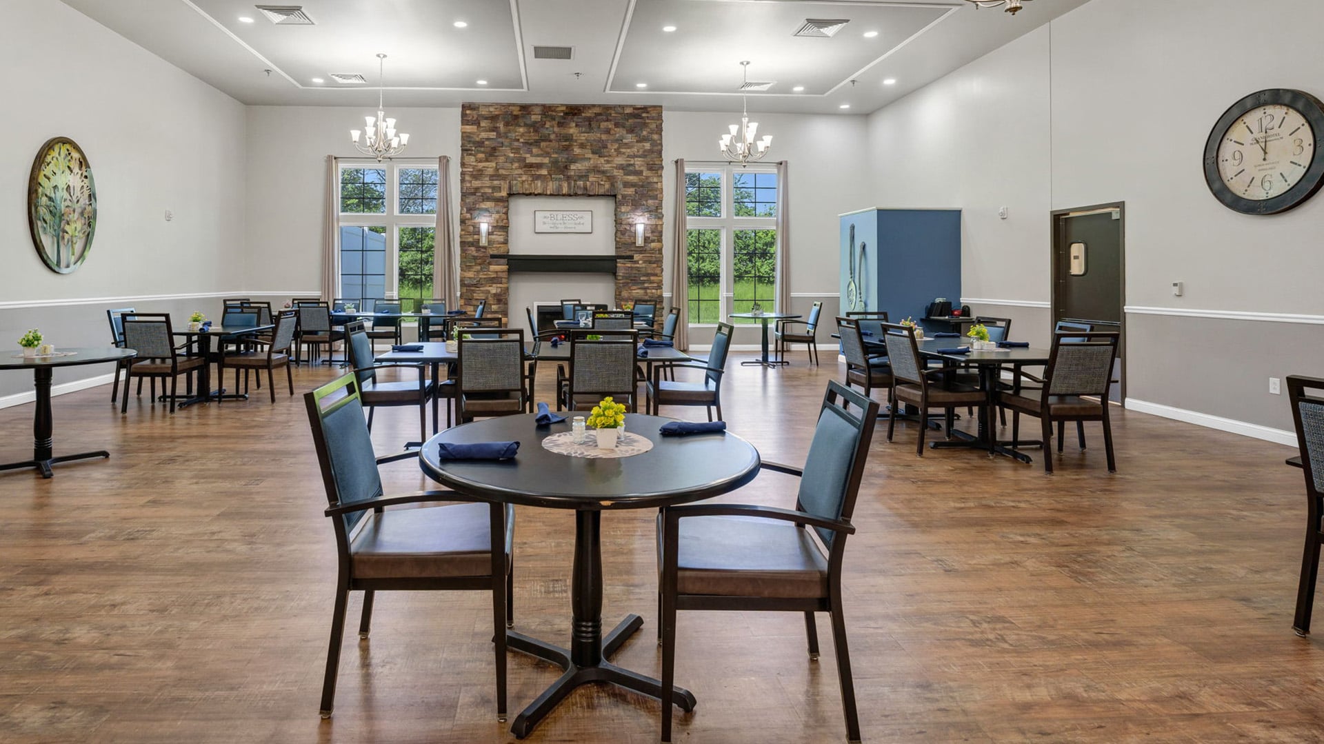 A spacious and bright dining room at Cedarhurst of Breese, offering comfortable seating for meals