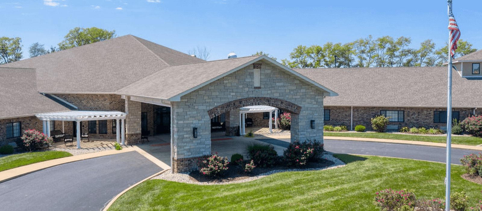 The welcoming front exterior of Cedarhurst of Breese senior living community.