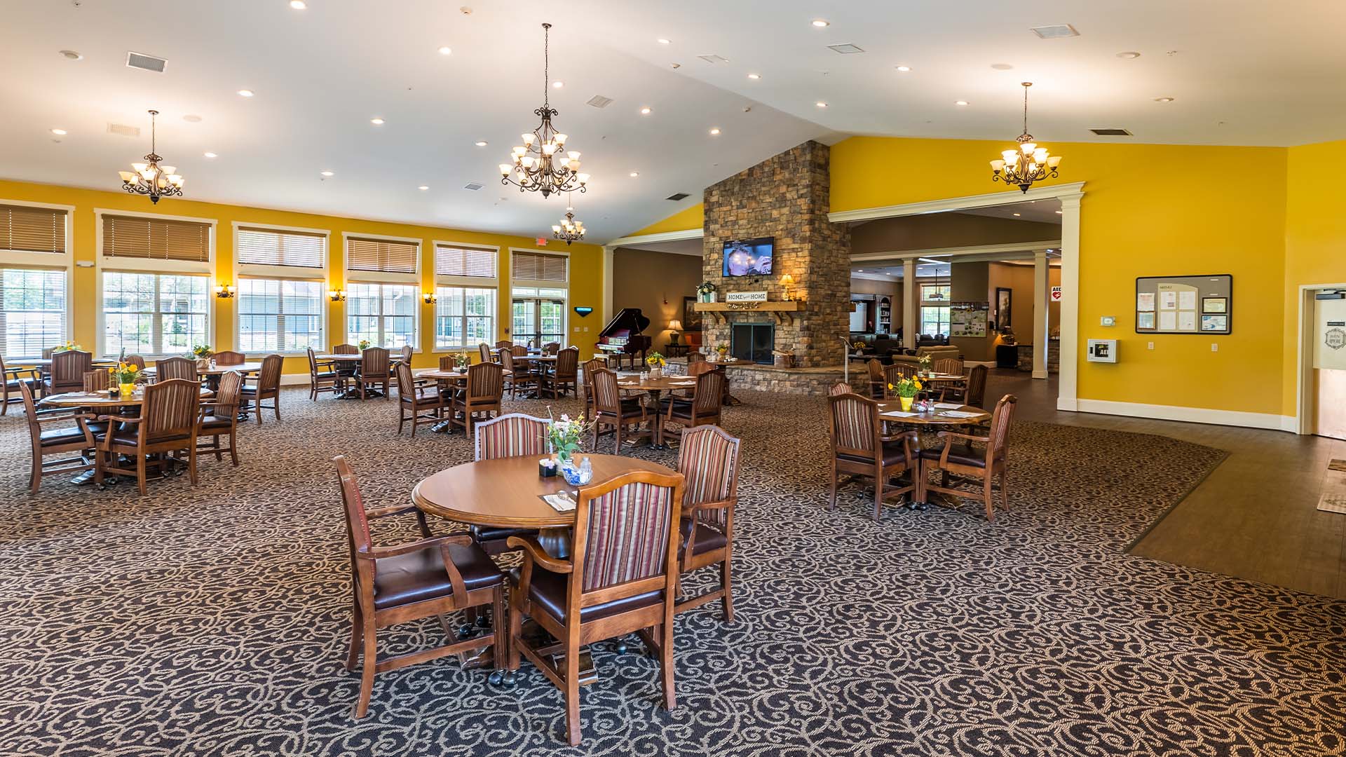 A spacious and bright dining room at Cedarhurst of Canton, offering comfortable seating for meals