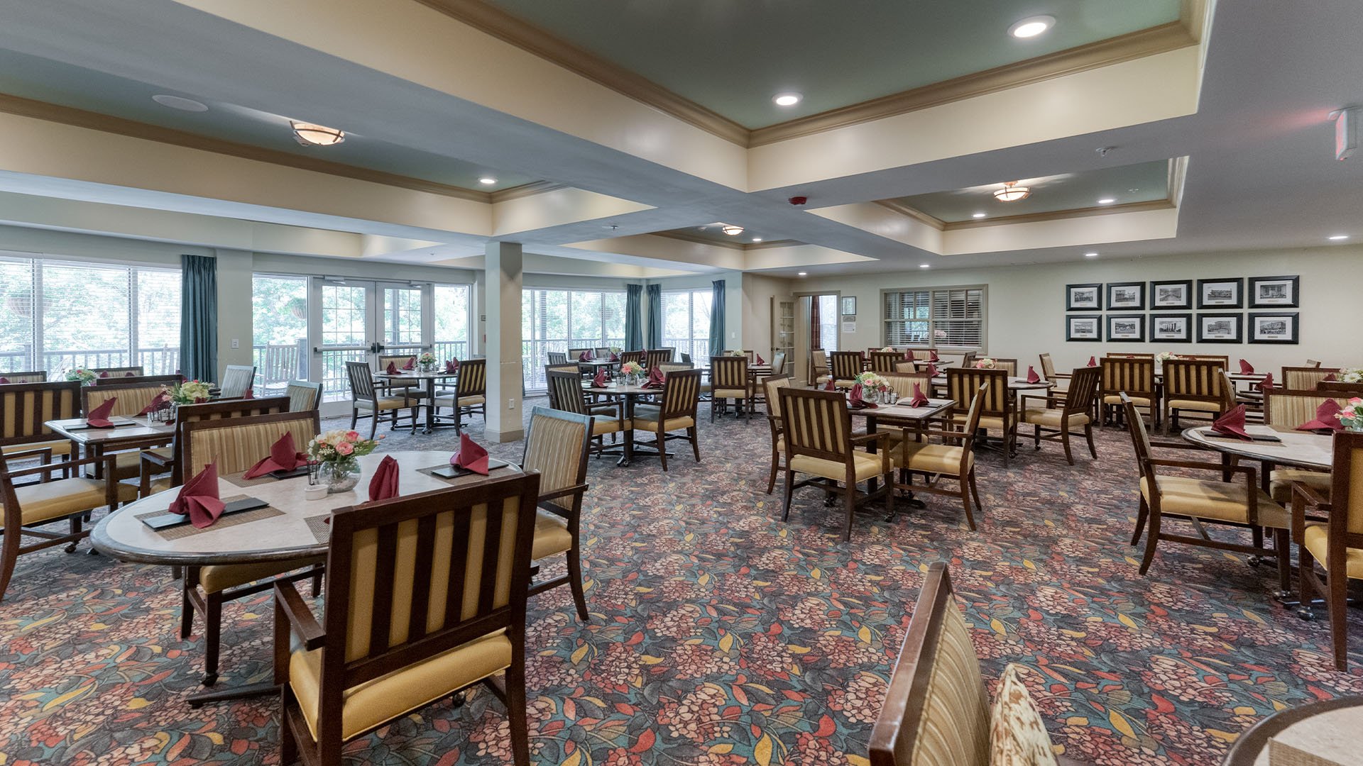 A spacious and bright dining room at Cedarhurst of Columbia, offering comfortable seating for meals