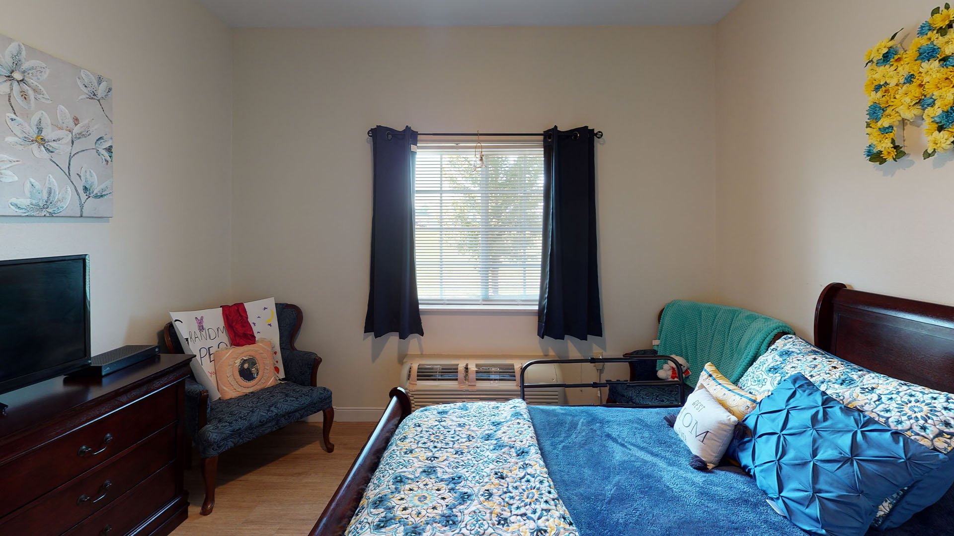 Bedroom of a senior apartment at Cedarhurst of Highland, designed for resident comfort and personalization