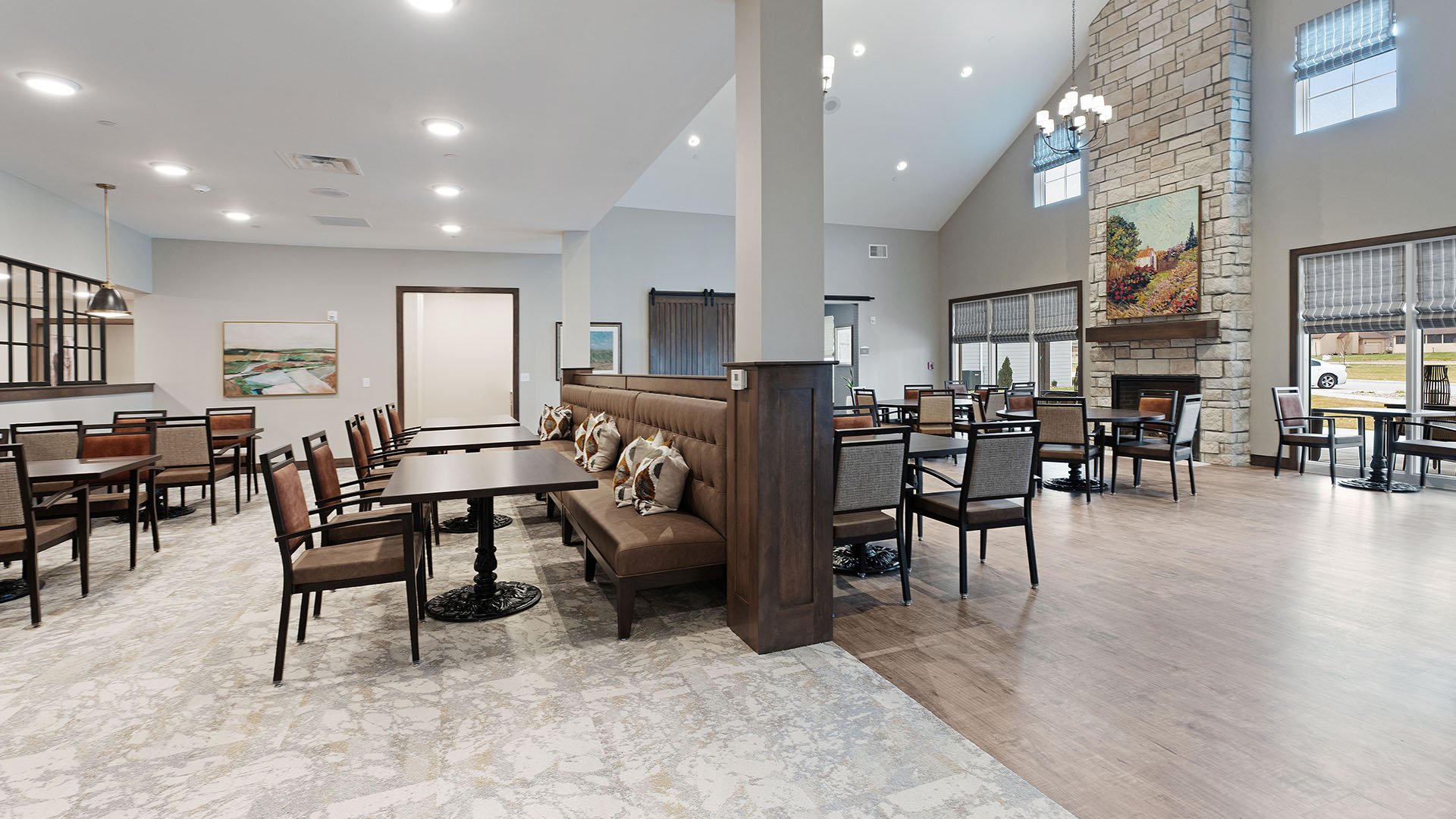 A spacious and bright dining room at Cedarhurst of Salina, offering comfortable seating for meals