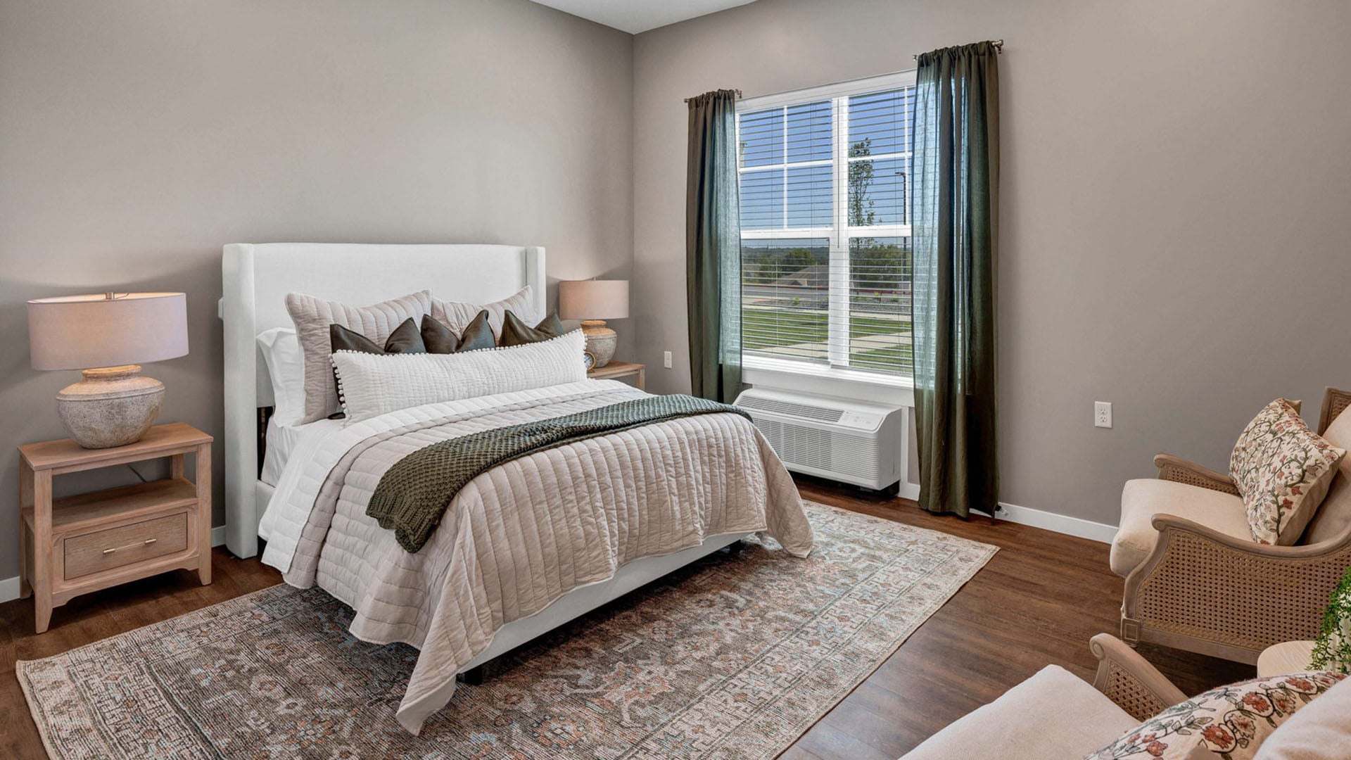 Bedroom of a senior apartment at Cedarhurst of Shawnee, designed for resident comfort and personalization