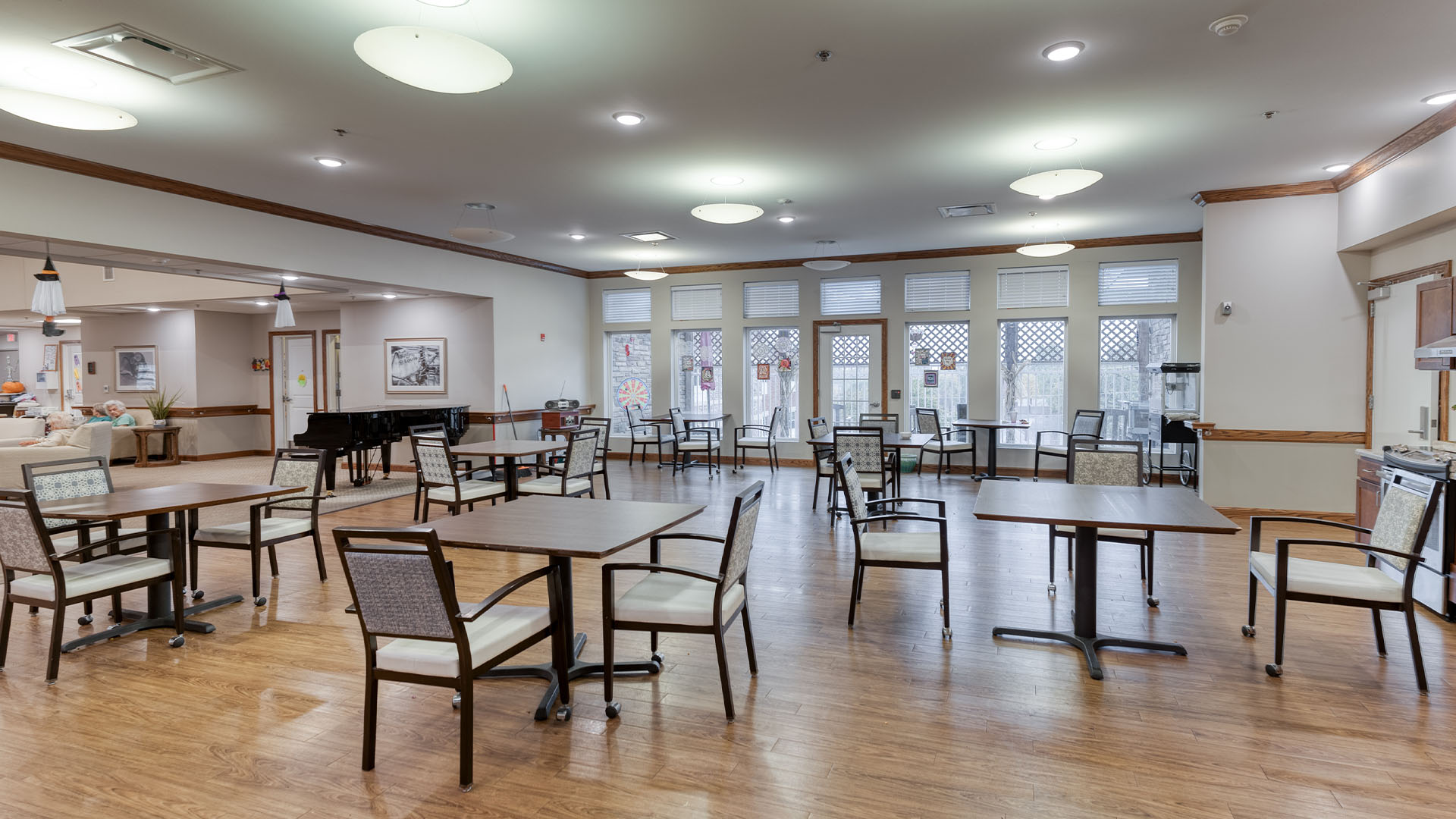 A spacious and bright dining room at Cedarhurst of St. Charles, offering comfortable seating for meals