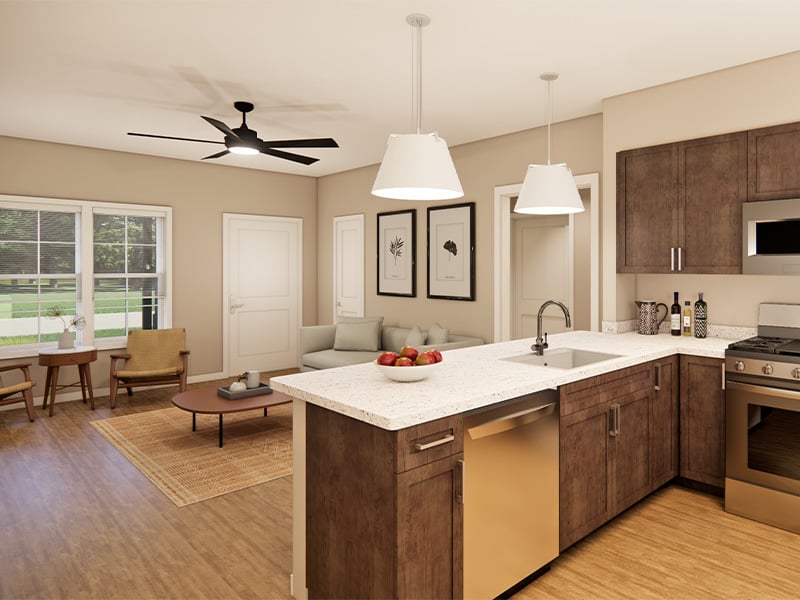Open-concept living room and kitchen inside of Cedarhurst of Topeka's Independent Living at Cedarhurst Cottages