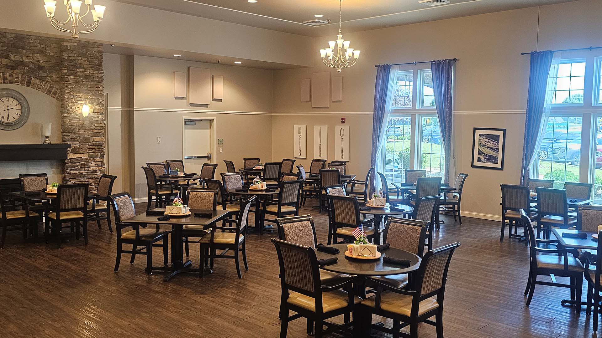 A spacious and bright dining room at Cedarhurst of Waterloo, offering comfortable seating for meals
