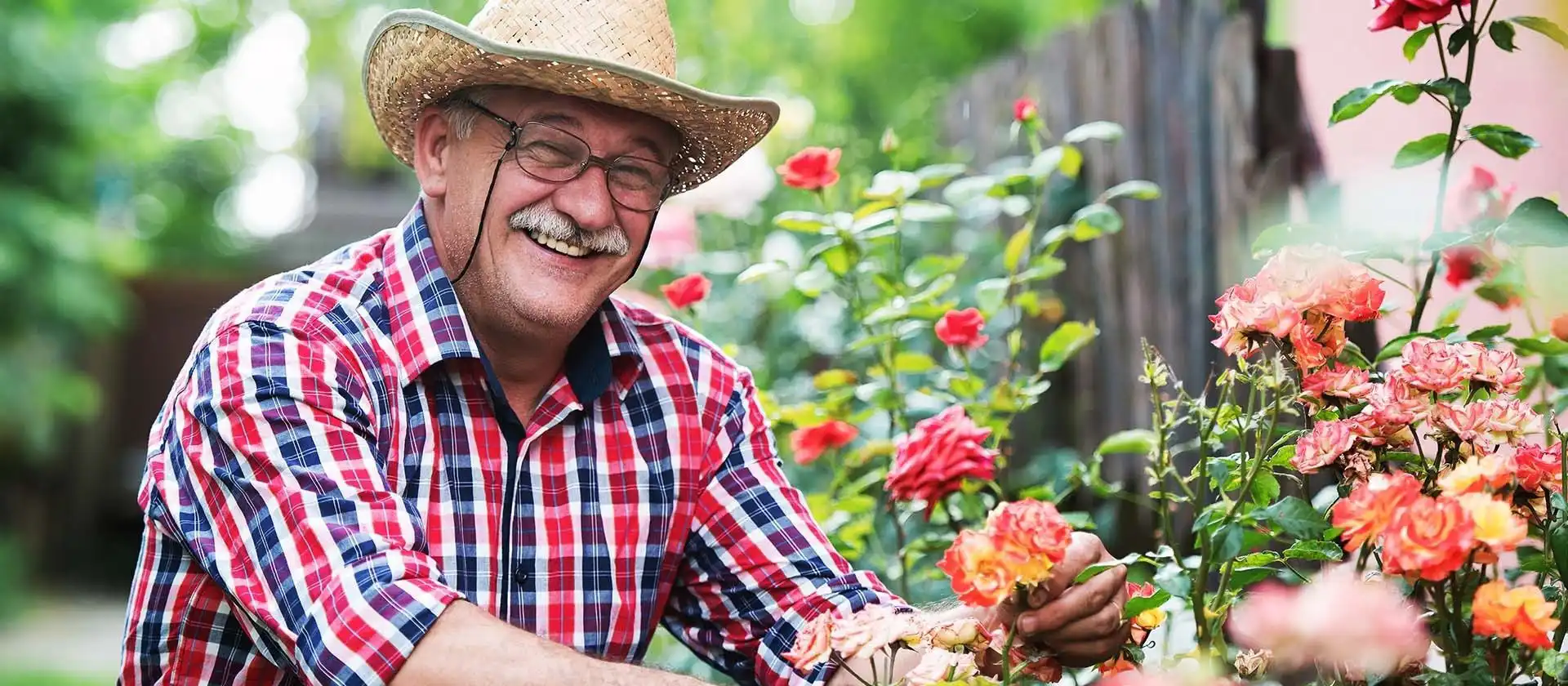 Senior living community resident gardening outdoors
