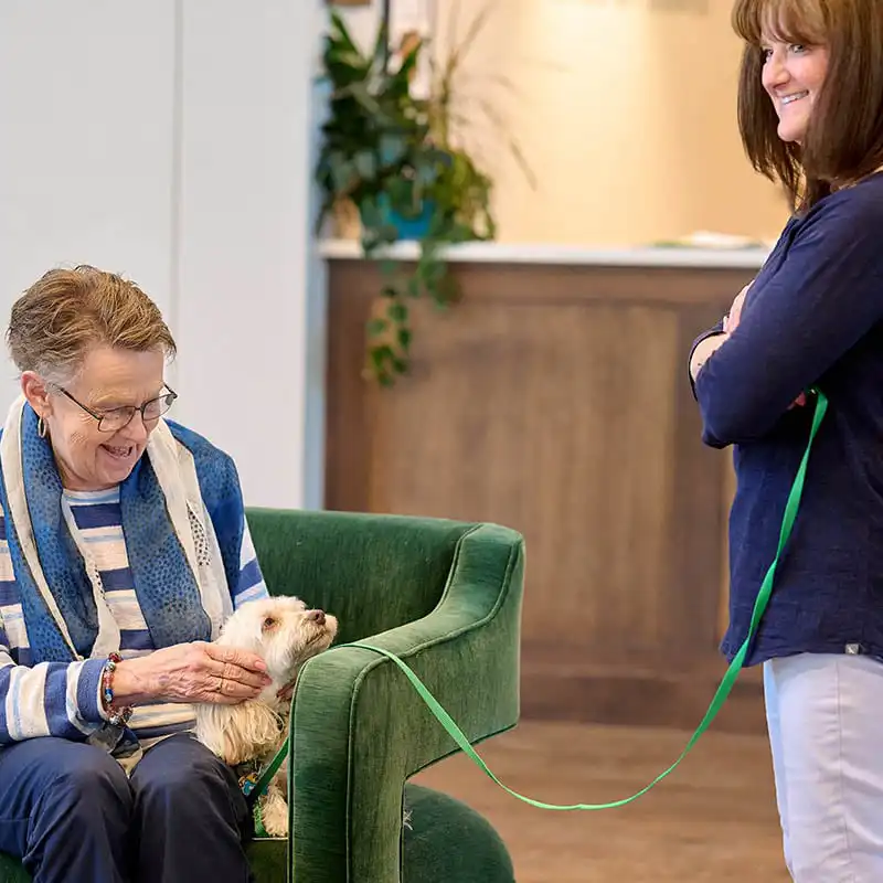 Senior resident and dog at senior living community