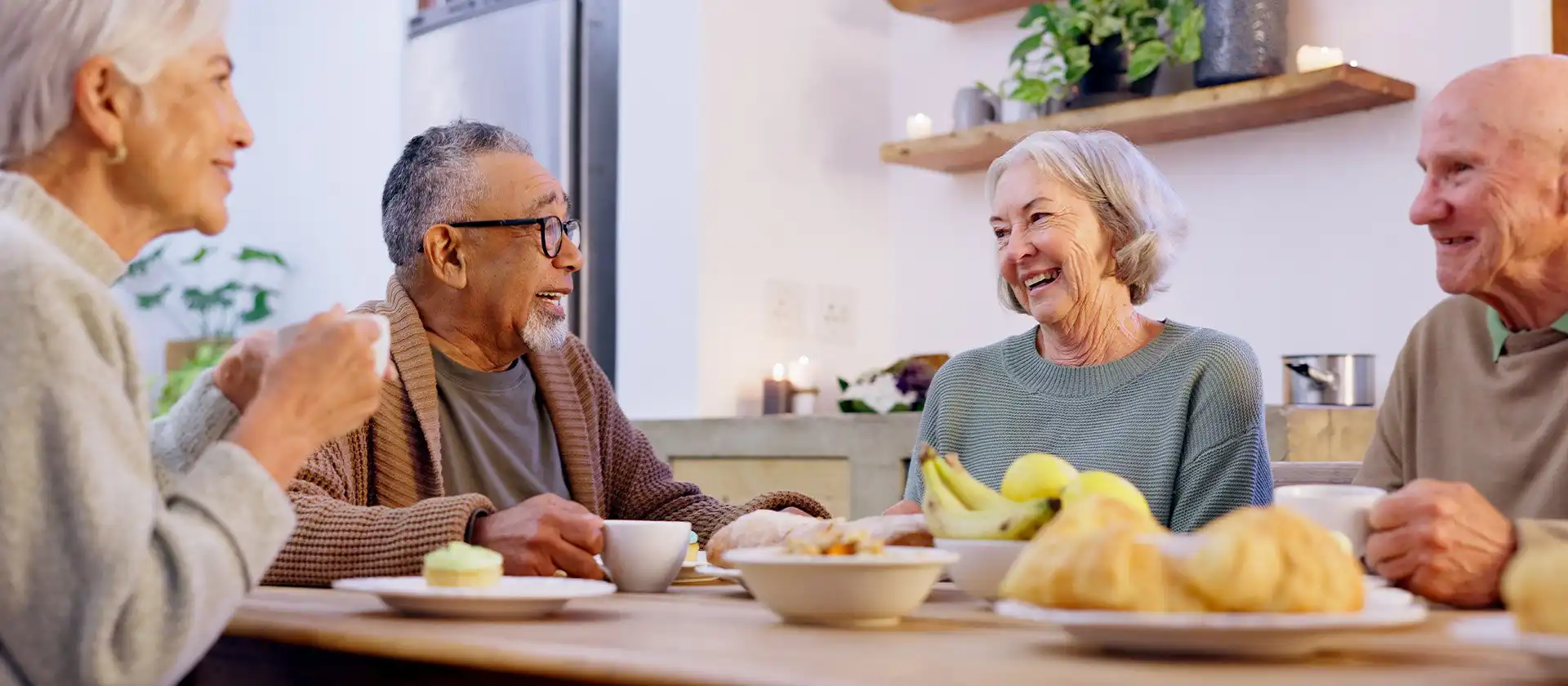 Residents at senior living community eating a meal together