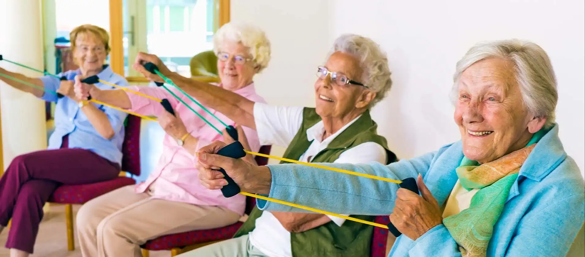 Senior living residents in group exercise class