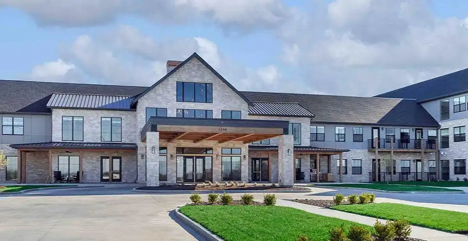 The welcoming exterior of Cedarhurst of Wentzville senior living community, with its prominent sign visible