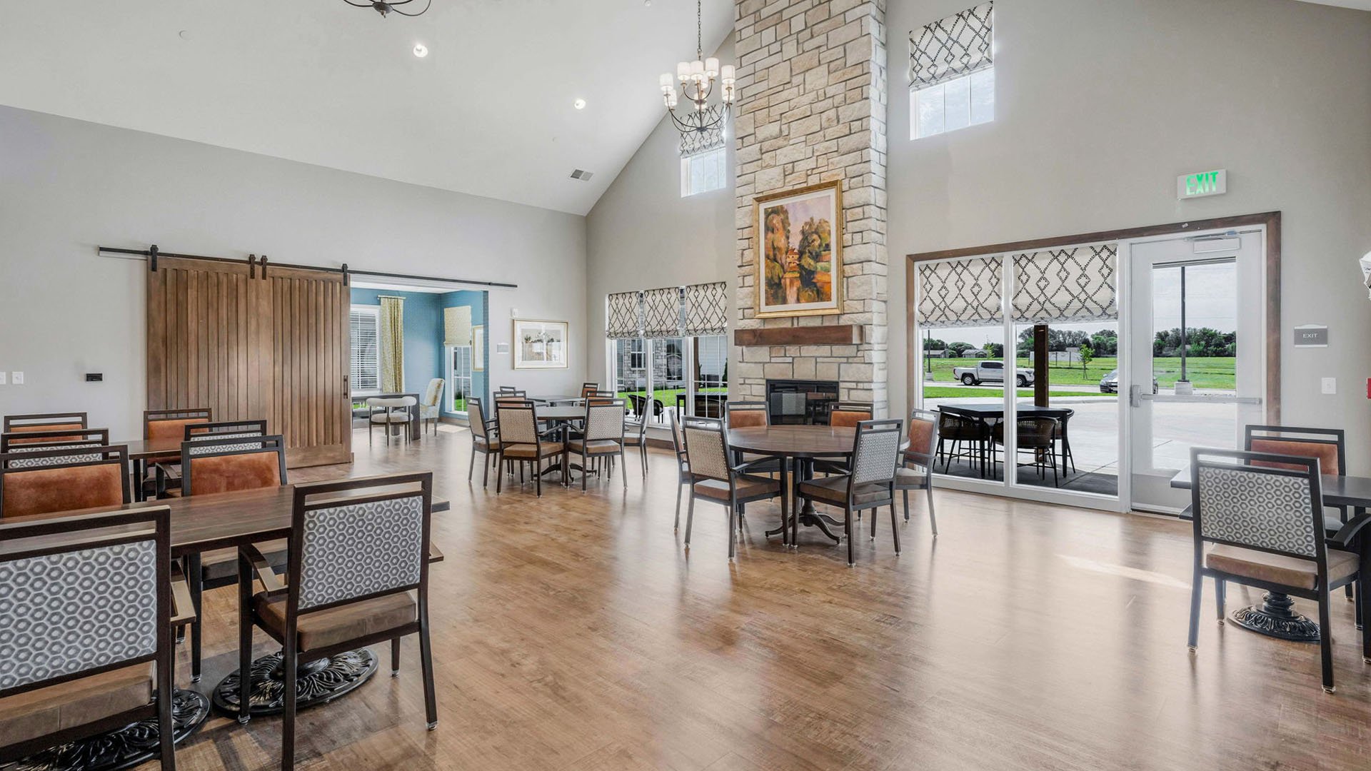 A spacious and bright dining room at Cedarhurst of Wichita, offering comfortable seating for meals