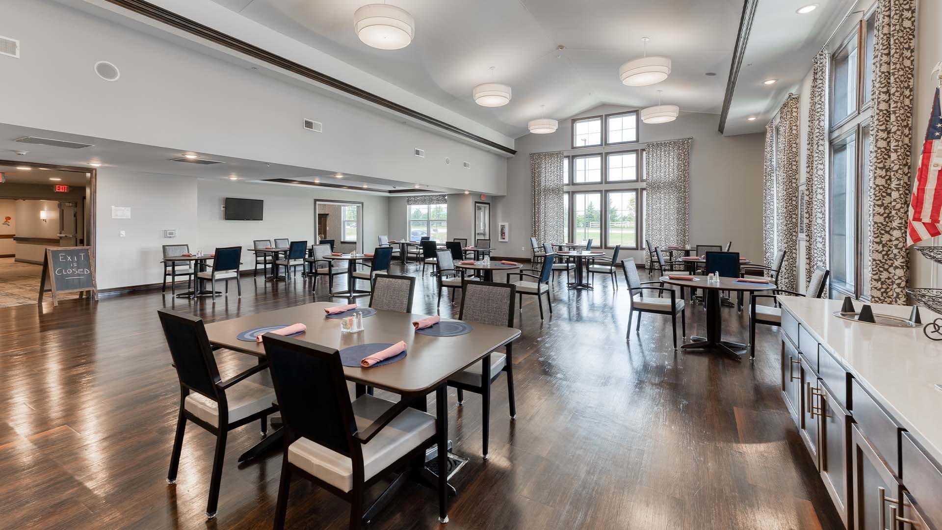 A spacious and bright dining room at Cedarhurst of Yorkville, offering comfortable seating for meals