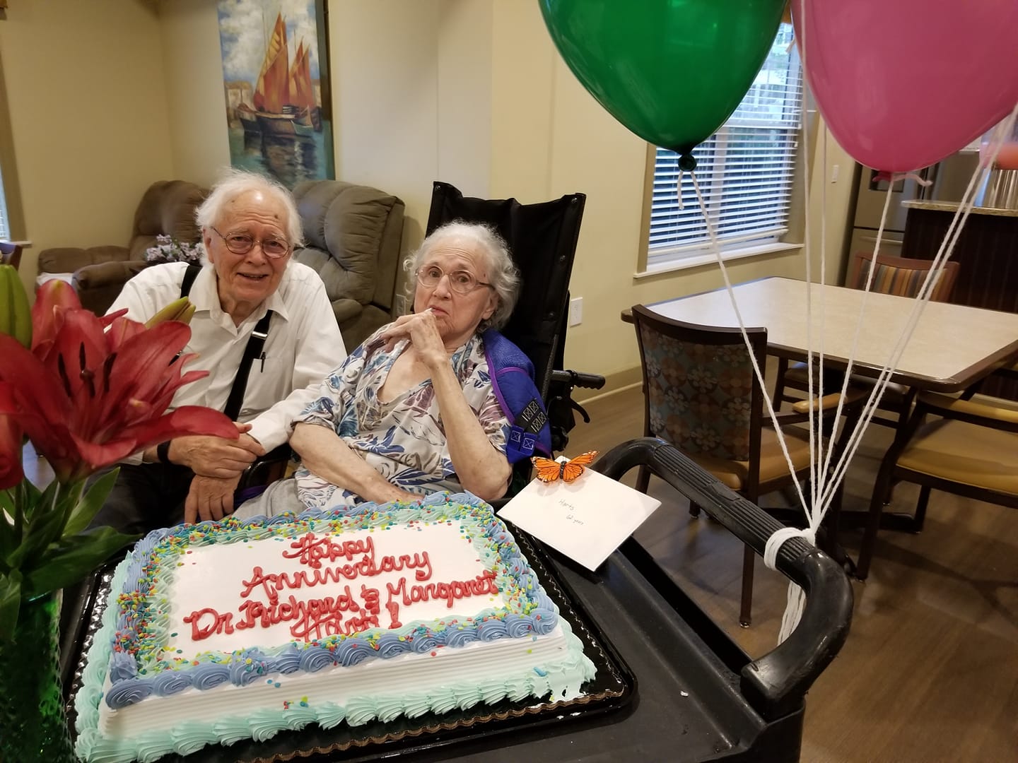 Dr. Hart and his wife Margaret with a birthday cake