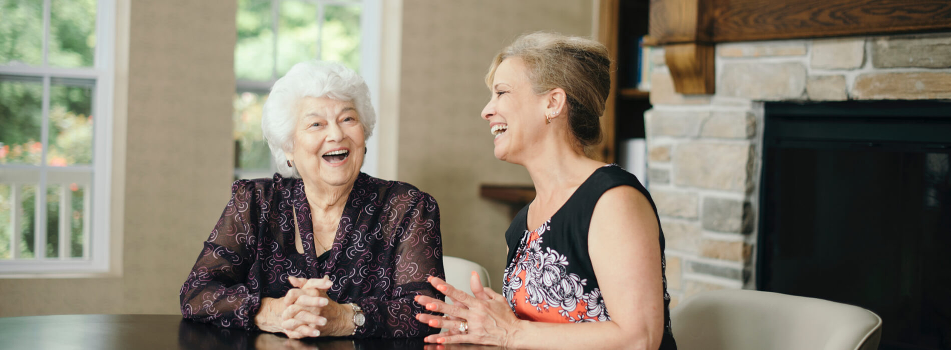 Senior talking with staff member