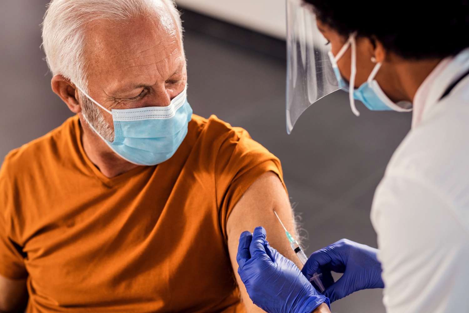 Senior man getting vaccinated