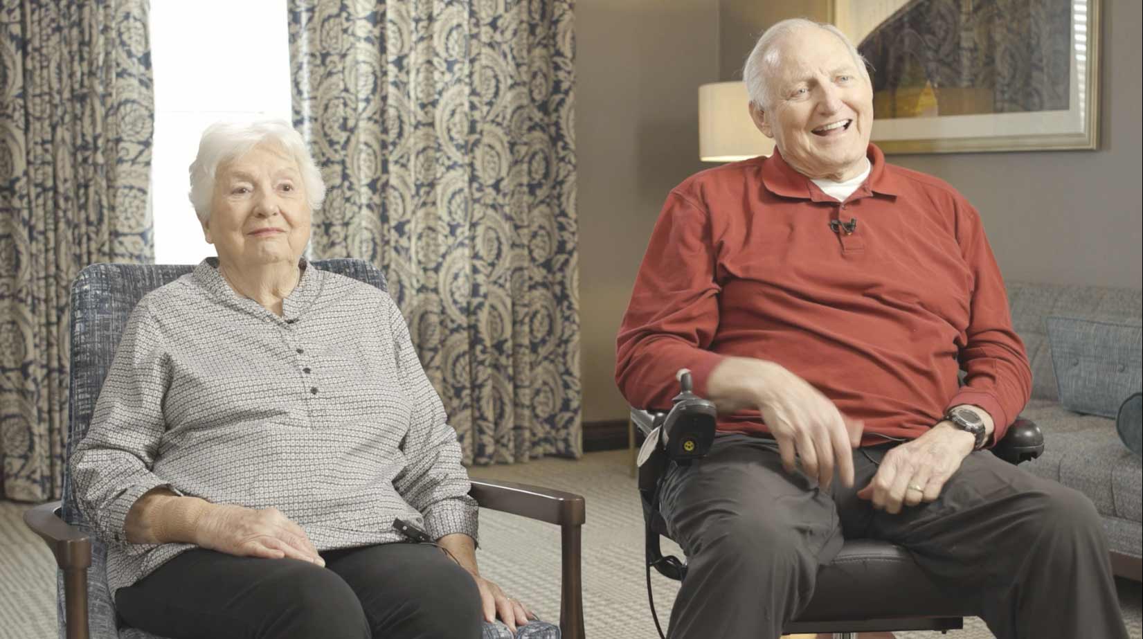 senior couple sitting for an filmed interview